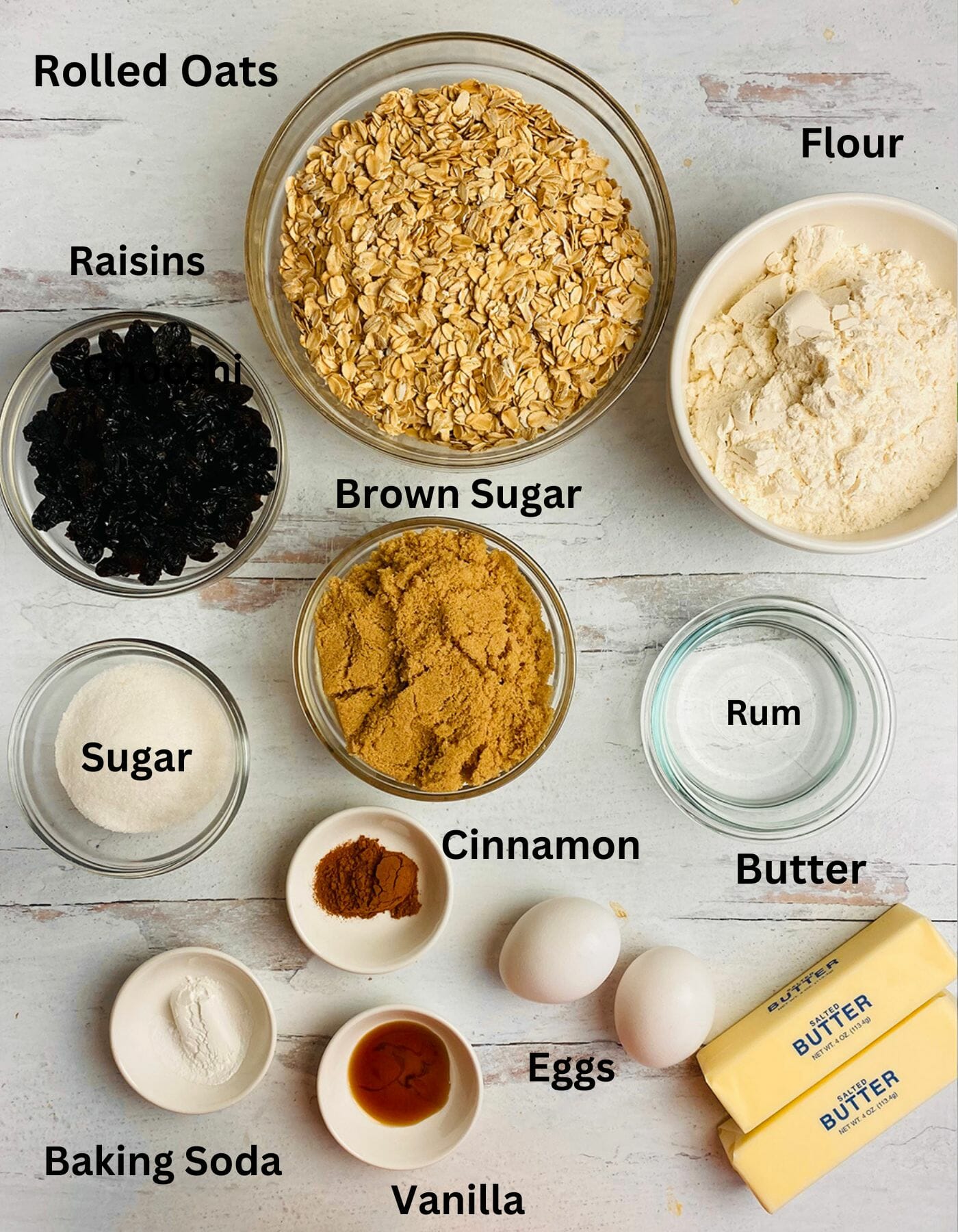 Rum raisin oatmeal cookie Ingredients on a wooden board.