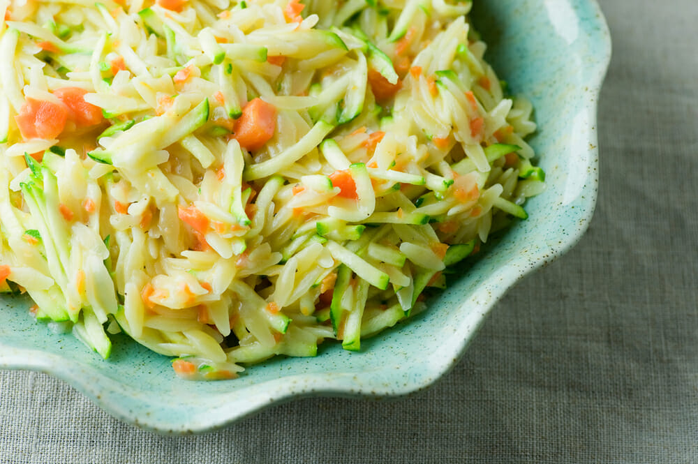Easy cheddar vegetable orzo in a bowl.