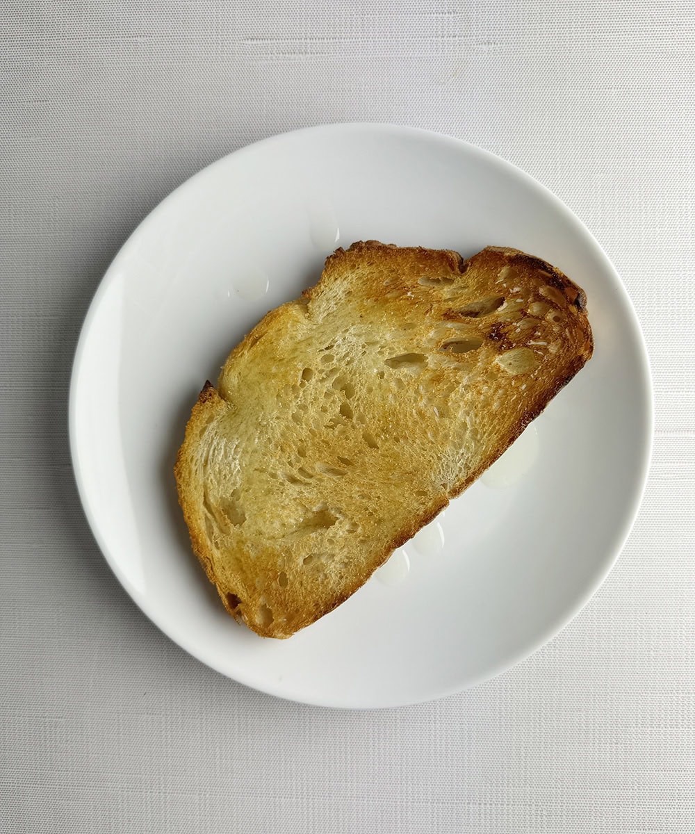 Toasted bread on a plate.