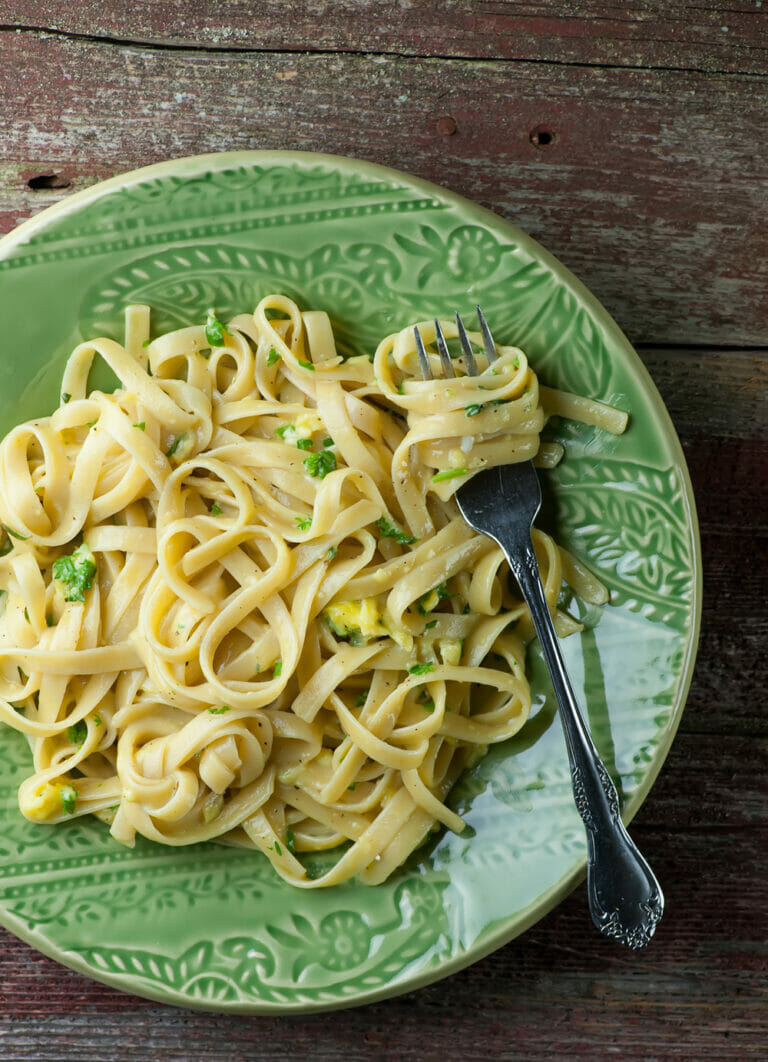 Pasta with Buttered Egg Sauce on a plate with a fork.