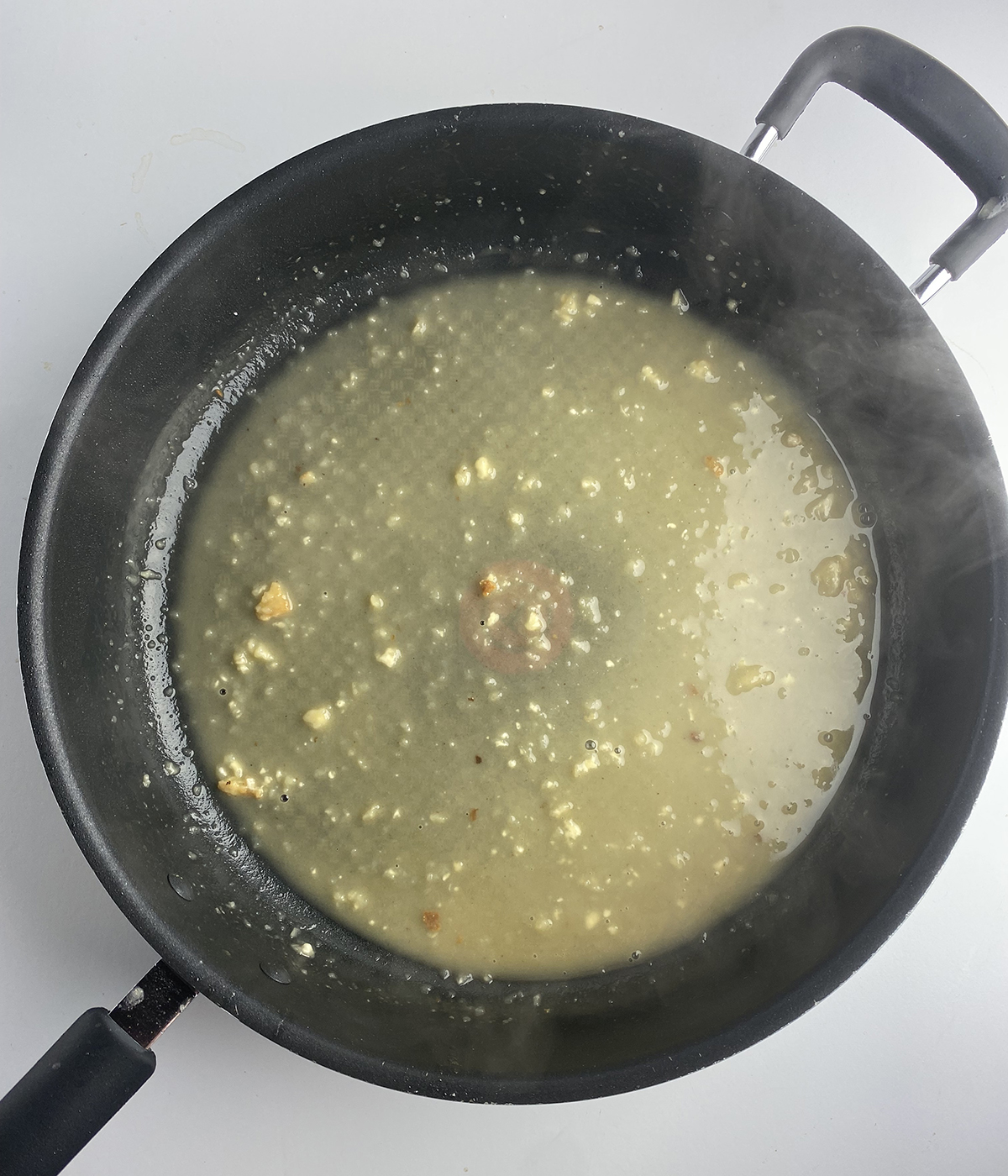 Lemon sauce in a skillet.