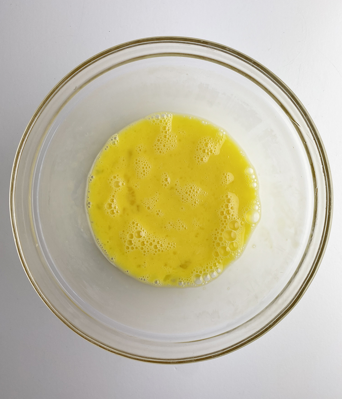 Beaten eggs in a bowl.