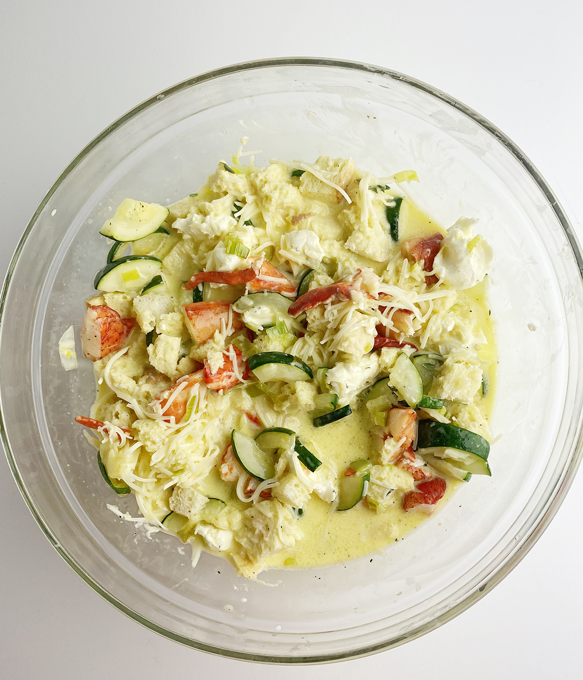 Lobster frittata mixture in a mixing bowl.