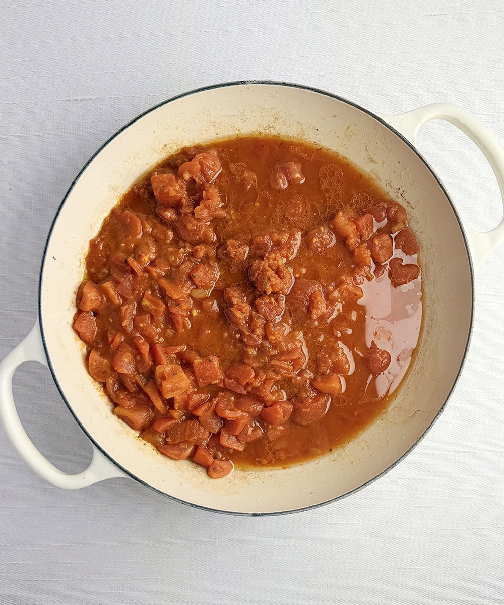 Tomato bacon sauce in a skillet.