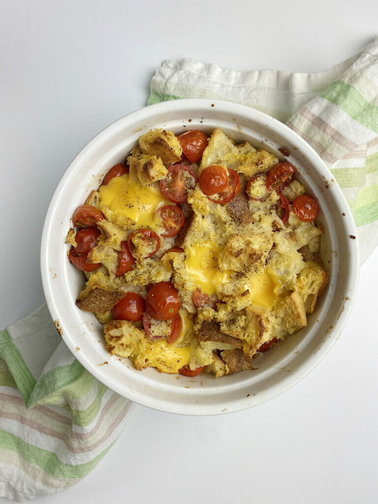 Grilled cheese bake casserole on a dishcloth.