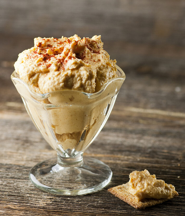 Cheddar cheese spread in a serving dish.