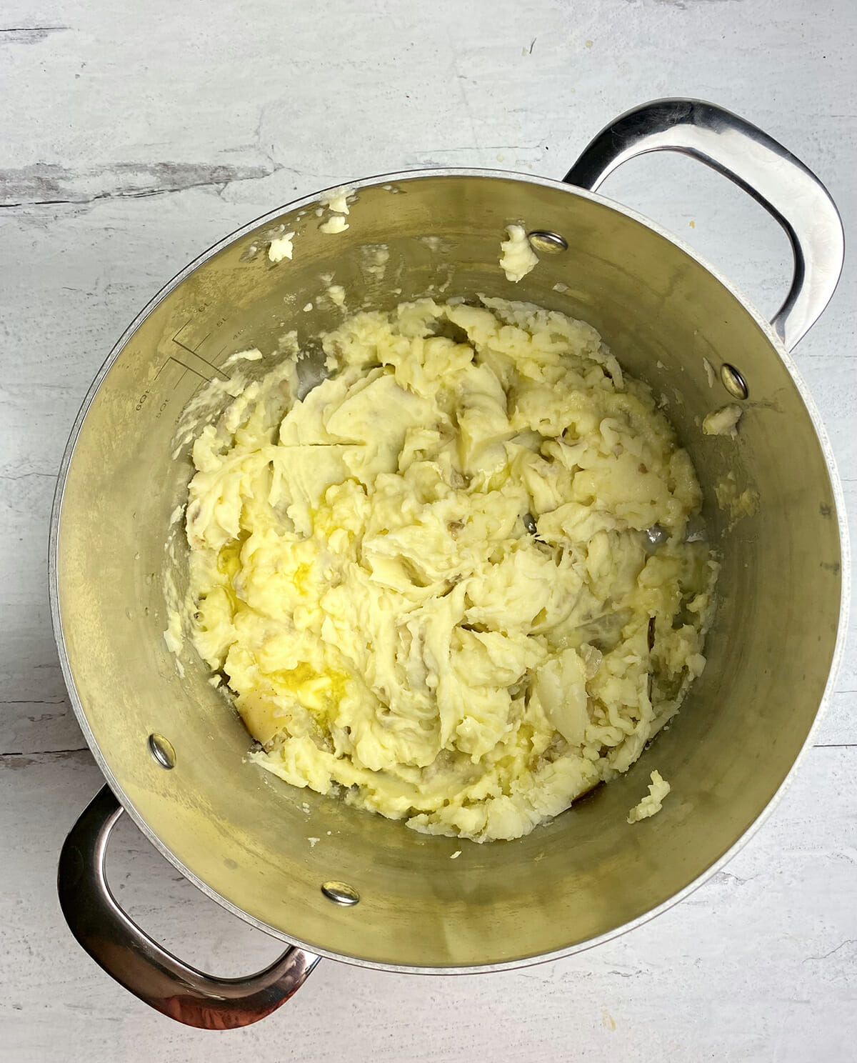 Mashed potatoes with butter in a pot.