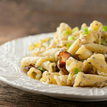 Pasta with Buttered Sour Cream and Bacon on a plate.