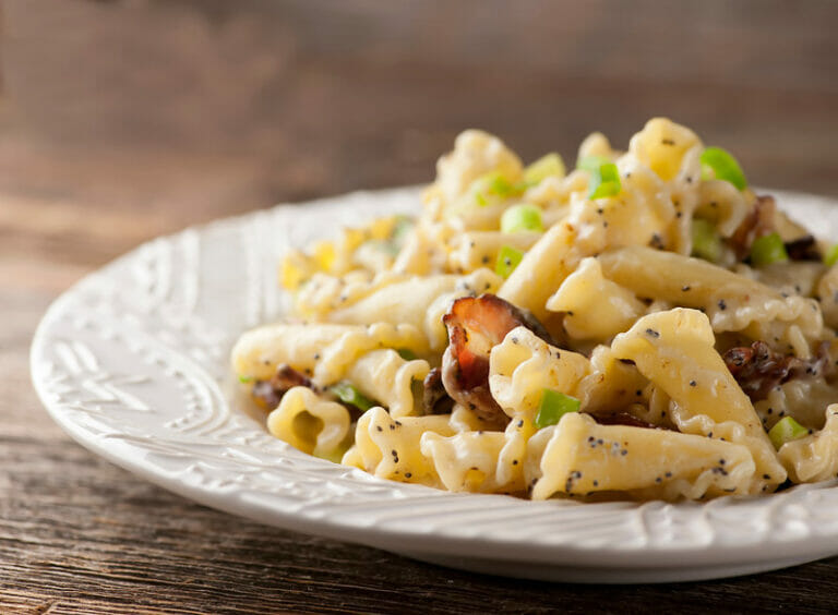 Pasta with Buttered Sour Cream and Bacon on a plate.