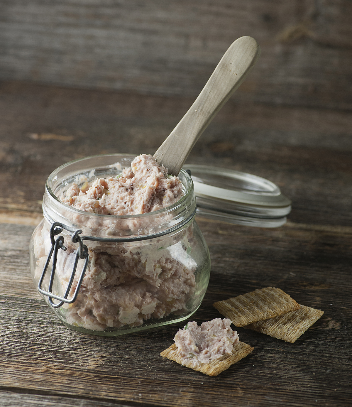 Deviled ham spread in a jar with crackers.