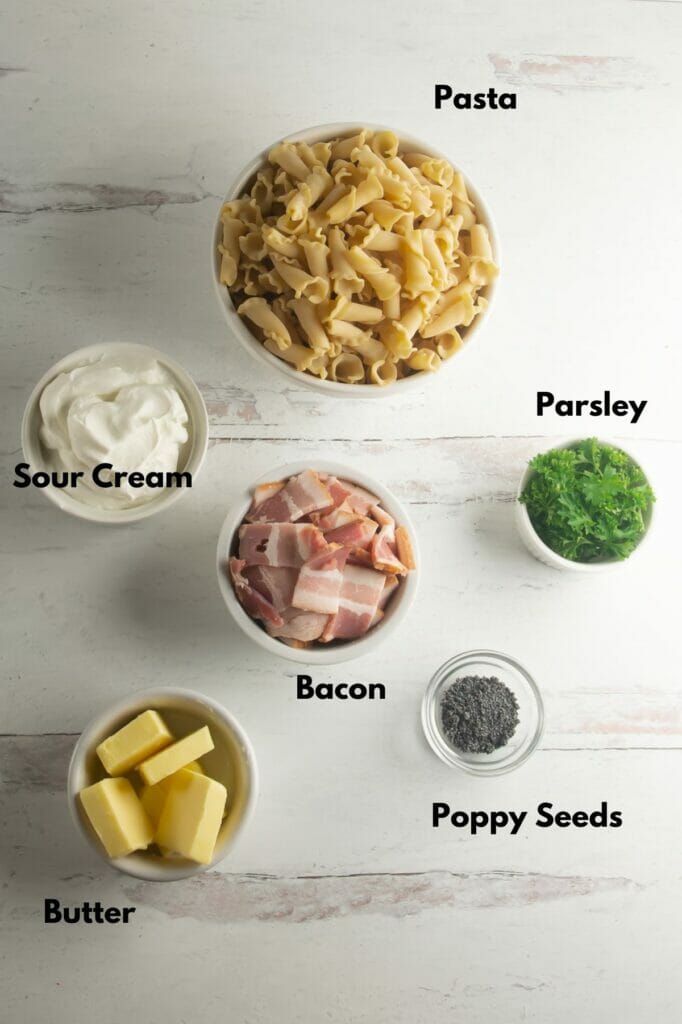 Pasta with Sour Cream Sauce Ingredients on a wooden counter.