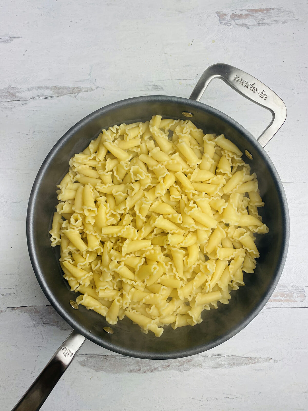 Cooked and drained pasta in a pot.