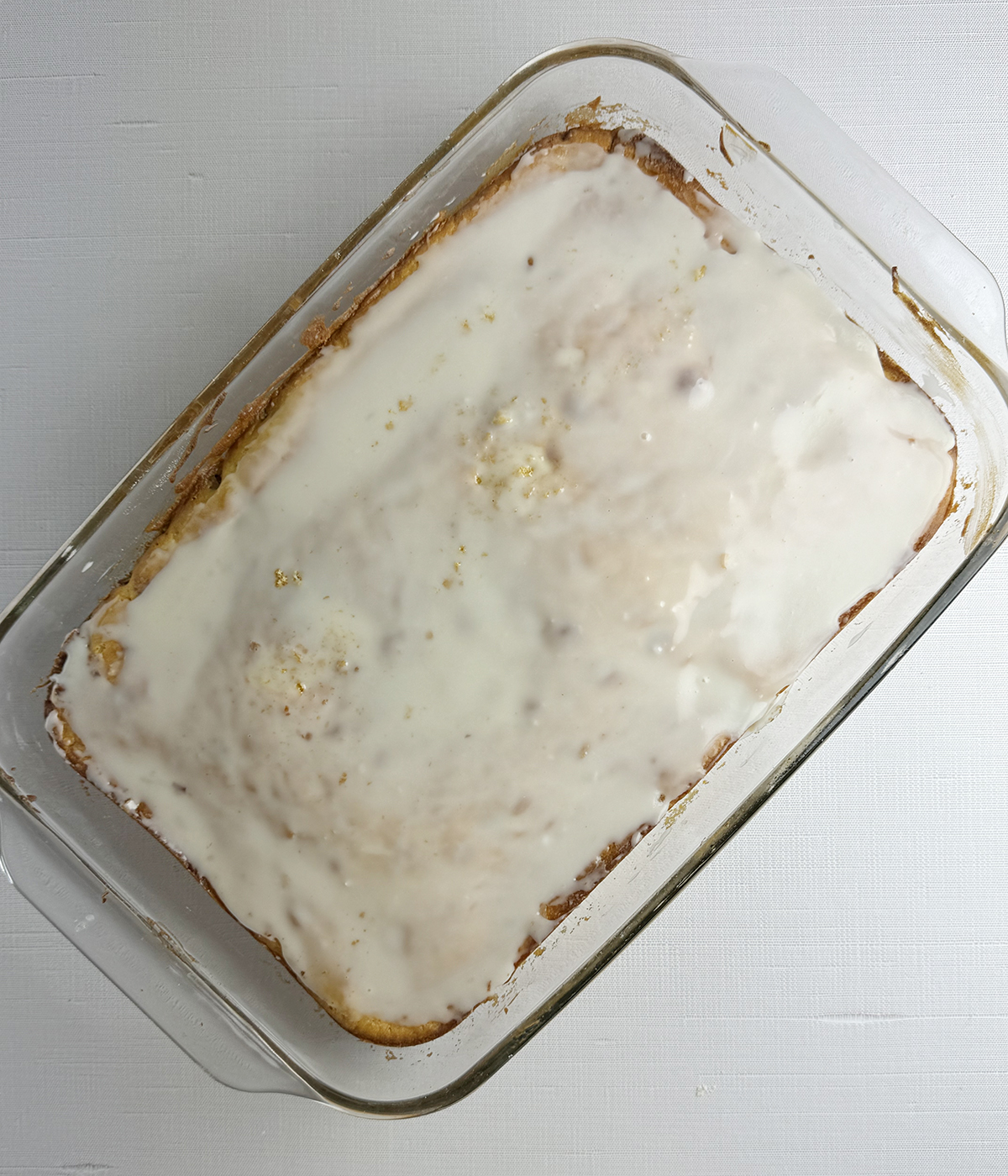 Glazed honeybun cake in a pan.