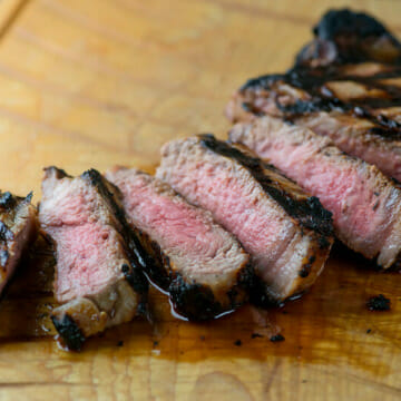 Buttermilk grilled steak on a cutting board.