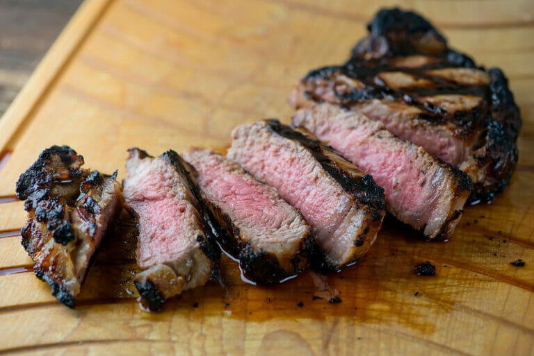 Buttermilk grilled steak on a cutting board.