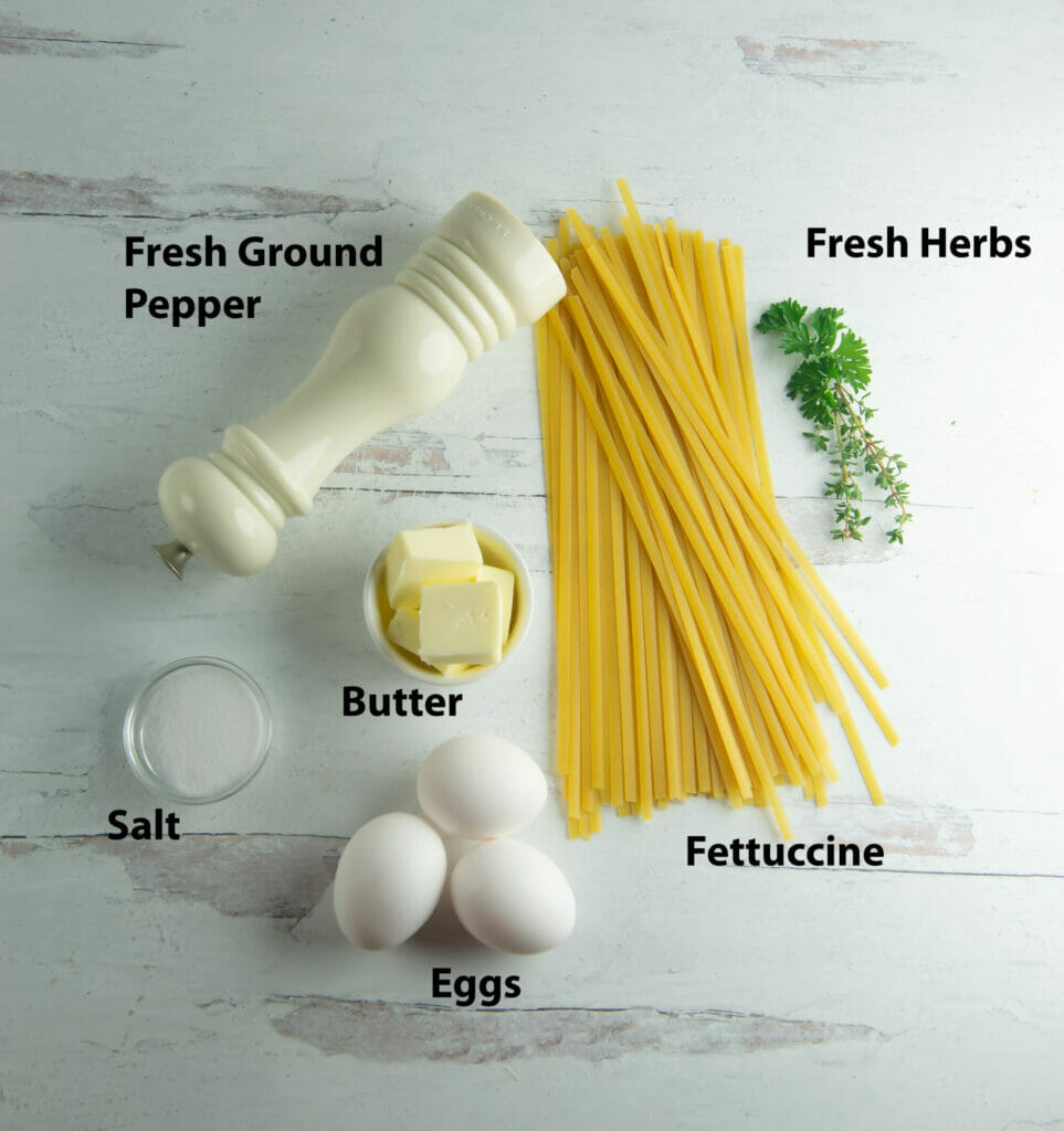 Buttered Egg Pasta Ingredients on a wooden counter.