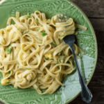 Pasta with Egg Sauce on a plate with a fork.