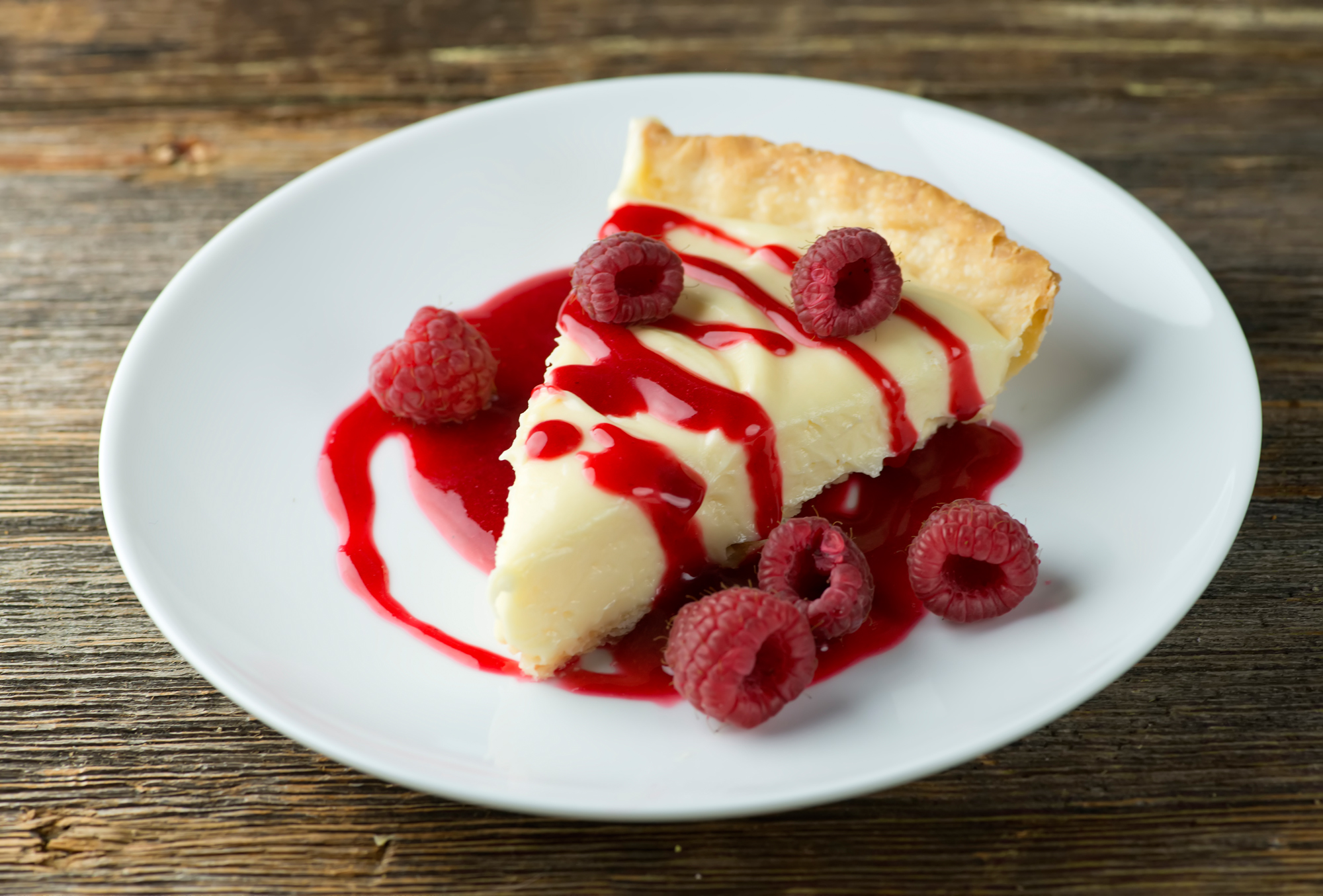 white chocolate lemon tart with raspberries