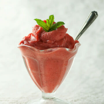 Strawberry Peach Sorbet in an ice cream glass.
