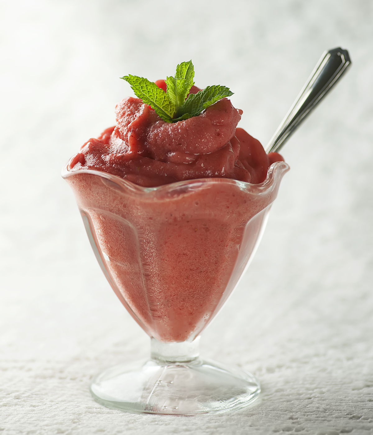 Strawberry Peach Sorbet in an ice cream dish.
