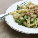 Blue Cheese Pesto Pasta on a plate with a fork.