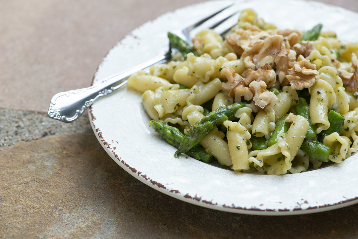 Blue Cheese Pesto Pasta on a plate with a fork.