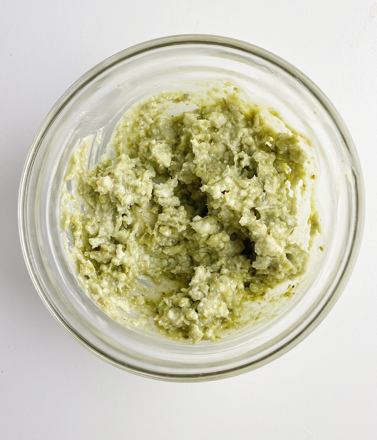 Blue cheese pesto and butter mixture in a mixing bowl.