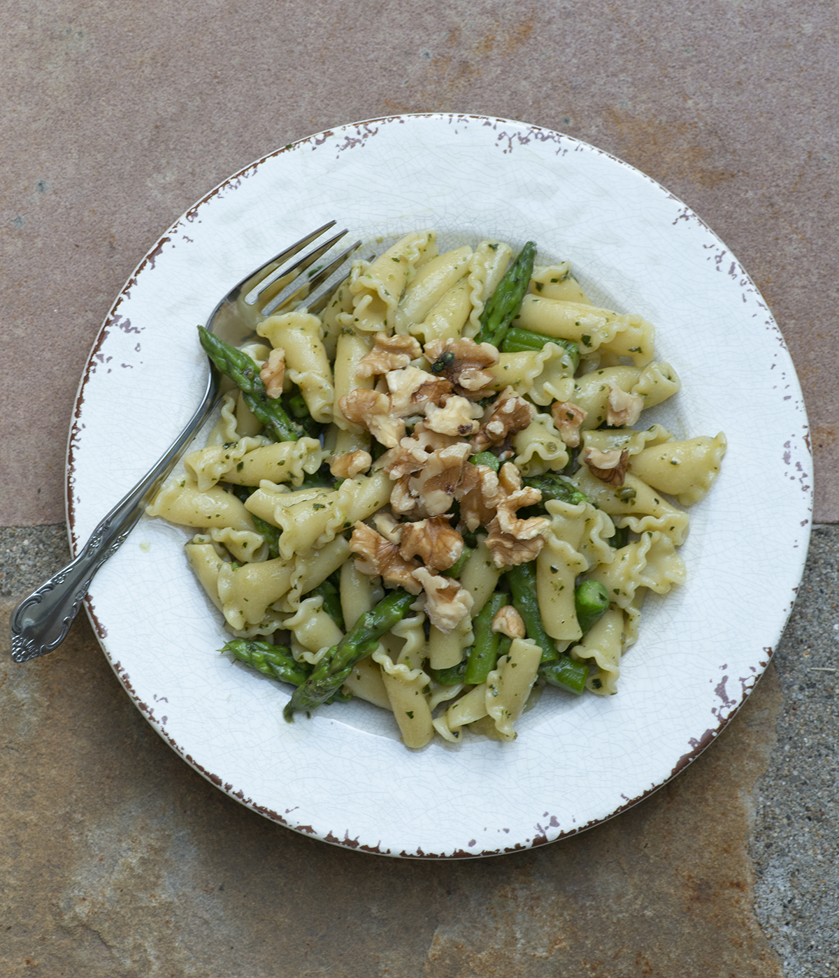 Blue cheese pesto pasta on a plate.