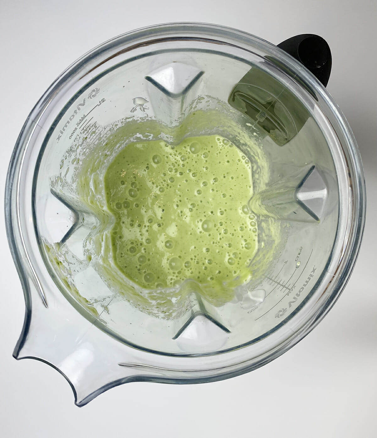 Pureed zucchini gazpacho in a blender.