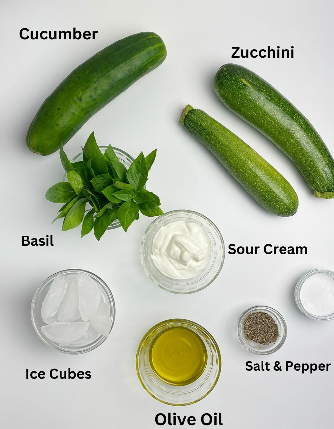 Zucchini gazpacho ingredients on a counter.
