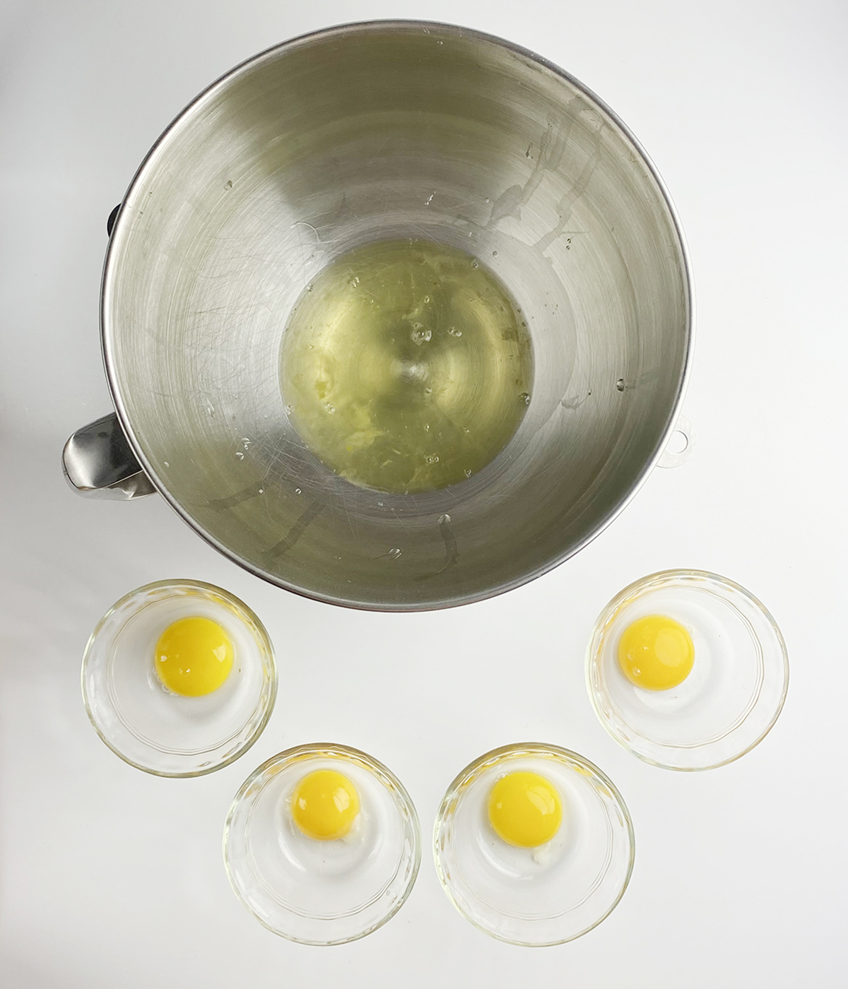 Separated eggs with the whites in a mixing bowl.