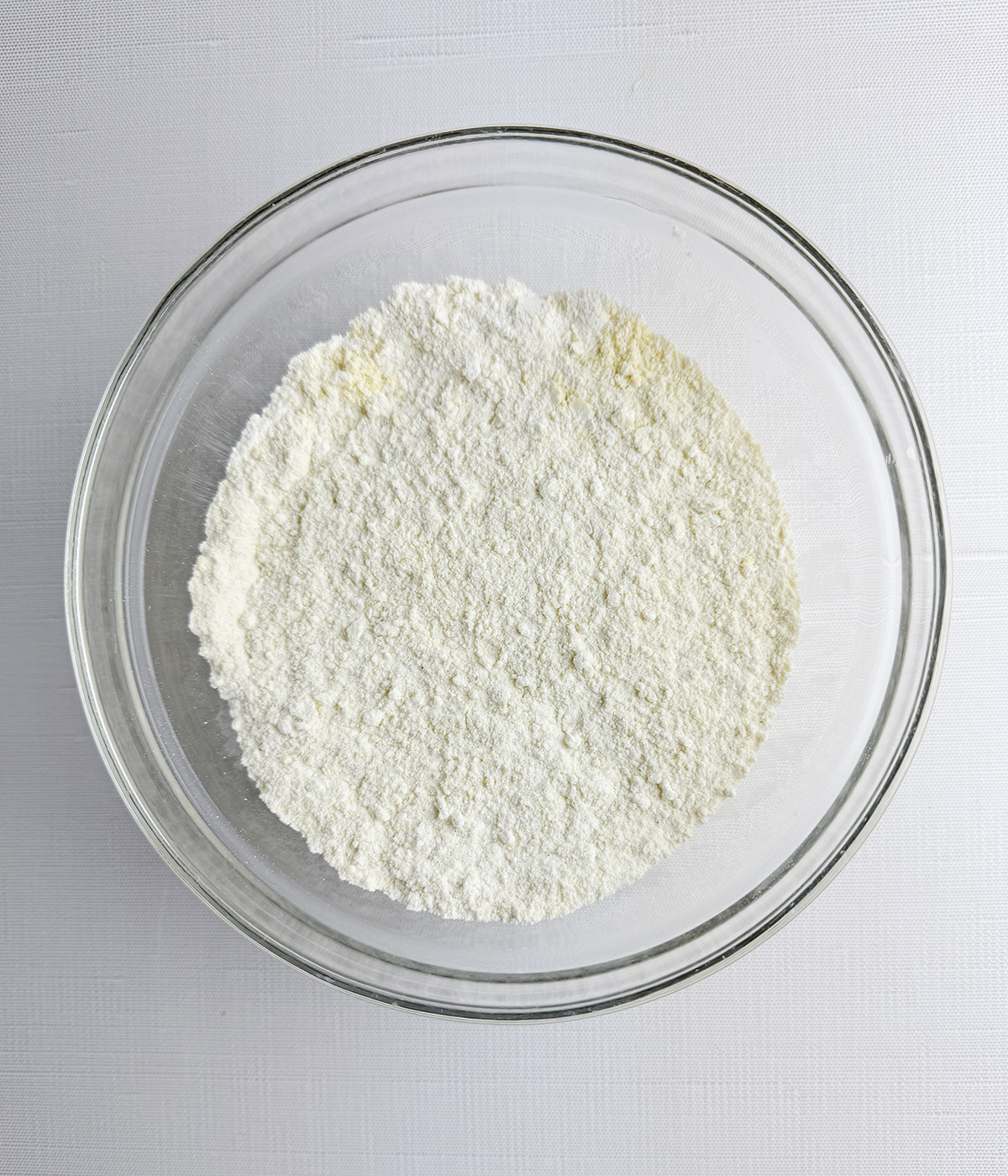 Flour and cornmeal mixture in a mixing bowl.