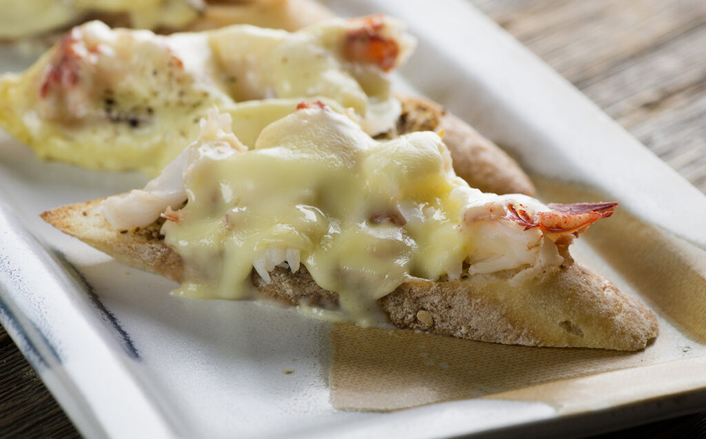 Grilled Lobster Brie Sandwishes on a platter.