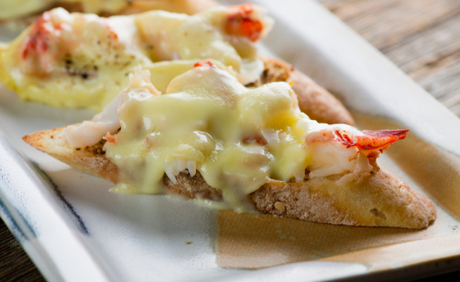 Lobster grilled cheese on a platter.