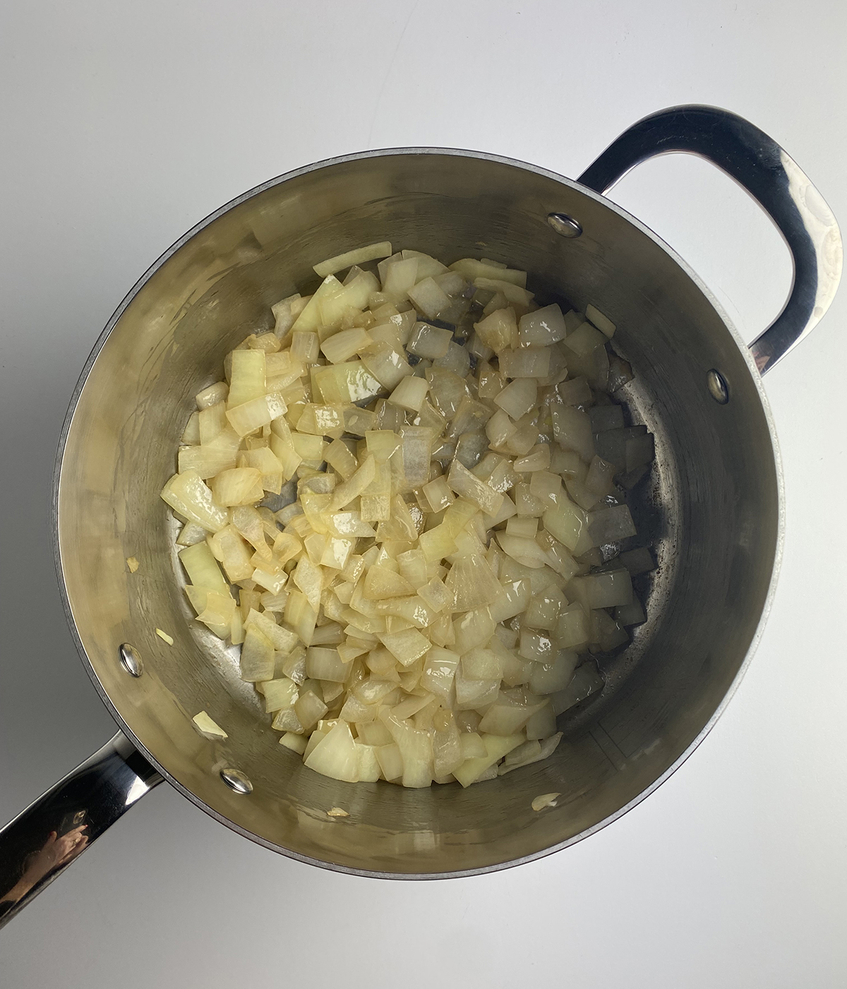 Sauteed onions in a pot.