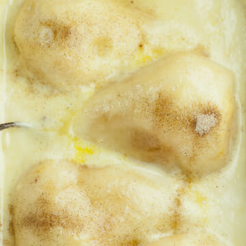 Pears in Vanilla Cream Sauce in a casserole dish.