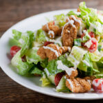Shortcut fried chicken salad on a plate.