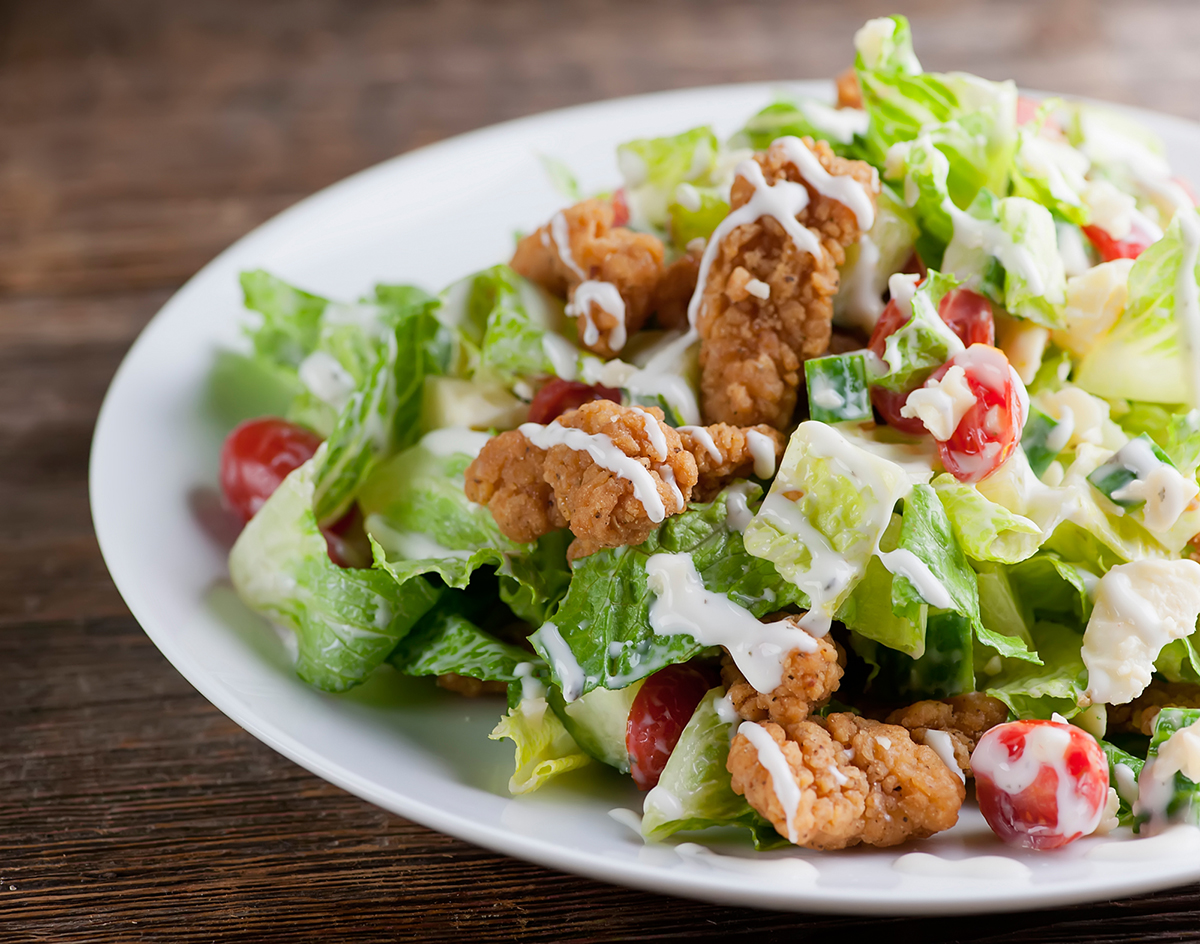 shortcut fried chicken salad Shortcut fried chicken salad on a plate.