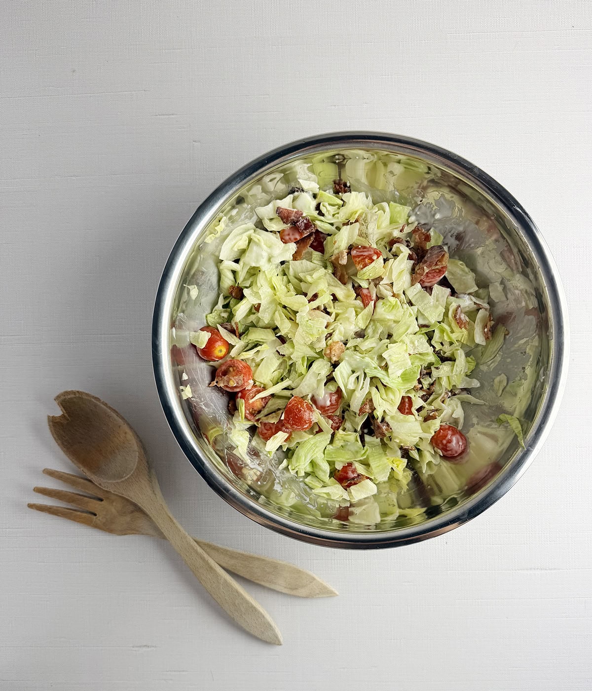 Wedge salad ingredients in a bowl.