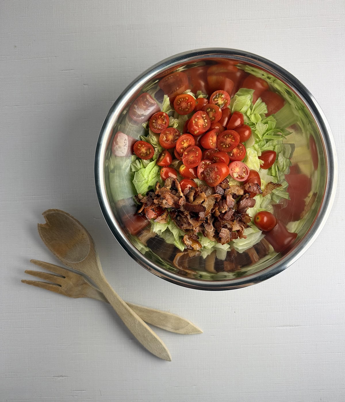 Wedge salad ingredients in a mixing bowl.
