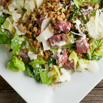 The best steak Caesar salad on a plate.