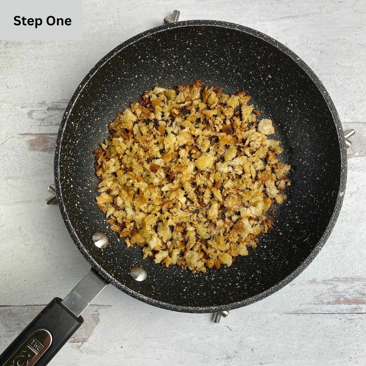 Toasted bread crumbs in a skillet.