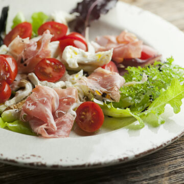 Prosciutto Caprese Salad on a plate.