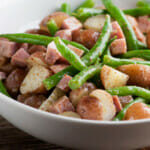 Ham and potato salad in a bowl.