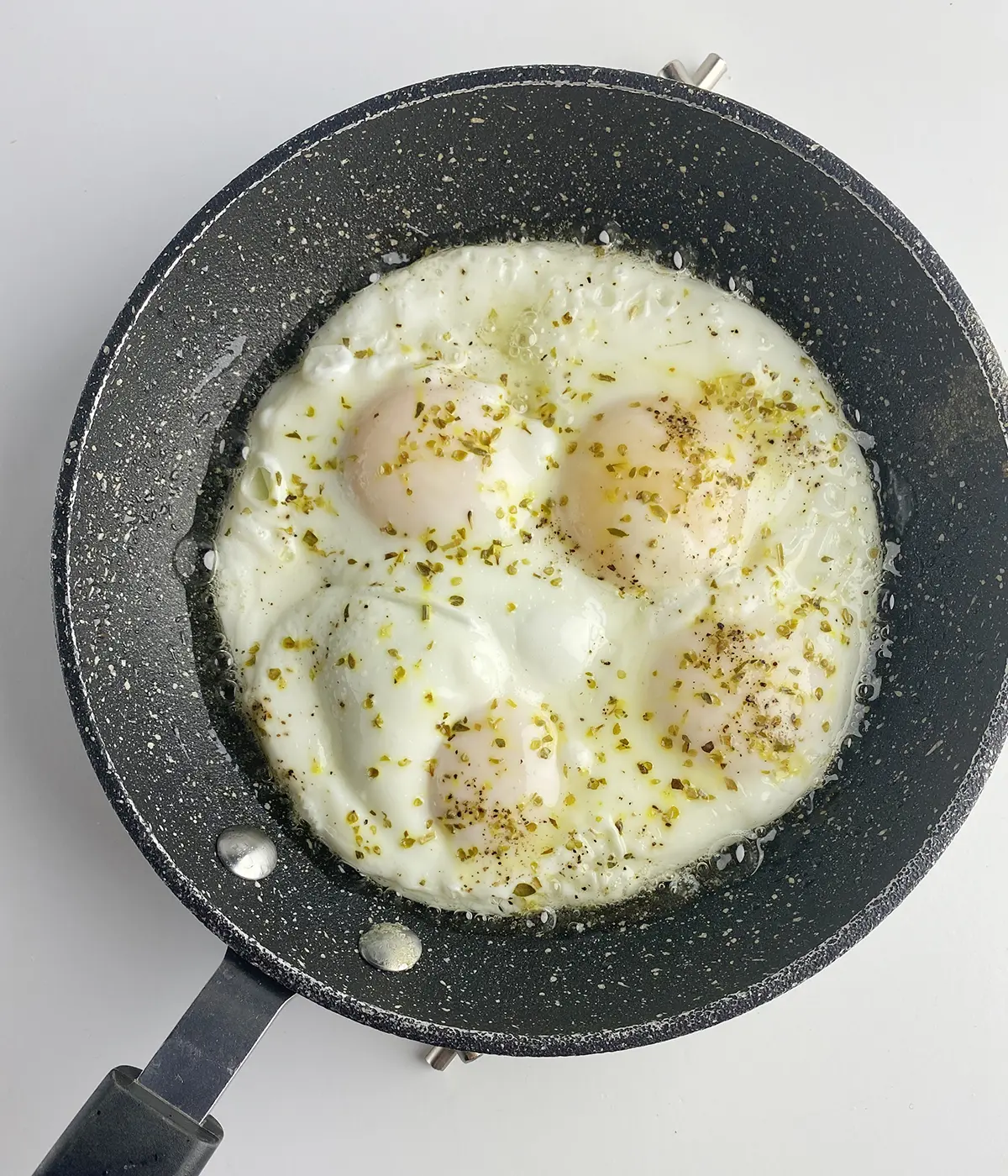 https://www.framedcooks.com/wp-content/uploads/2015/09/Perfect-fried-eggs-cooked-in-a-skillet.jpg.webp