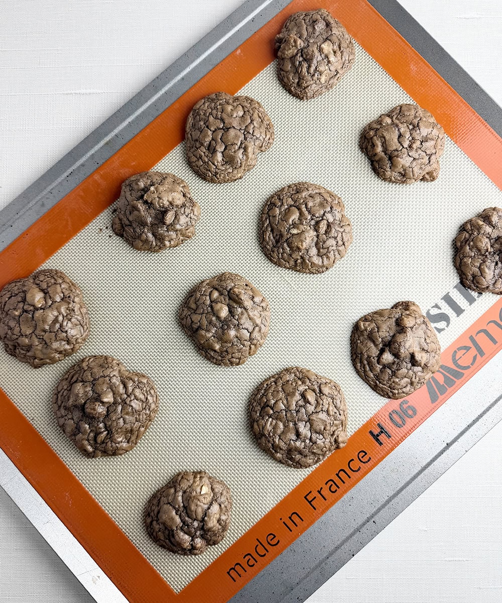 Brownie cookies on a cookie sheet.