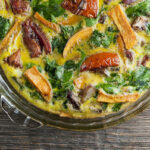 Roasted vegetable frittata in a pie plate.