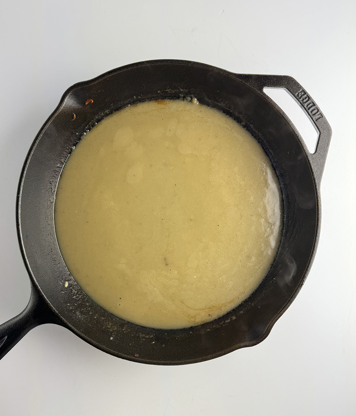 White wine sauce in a skillet.