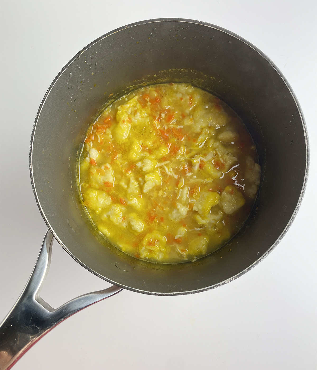 Chicken and baby dumpling soup in a pot.