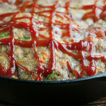 Meatloaf in a cast iron skillet.